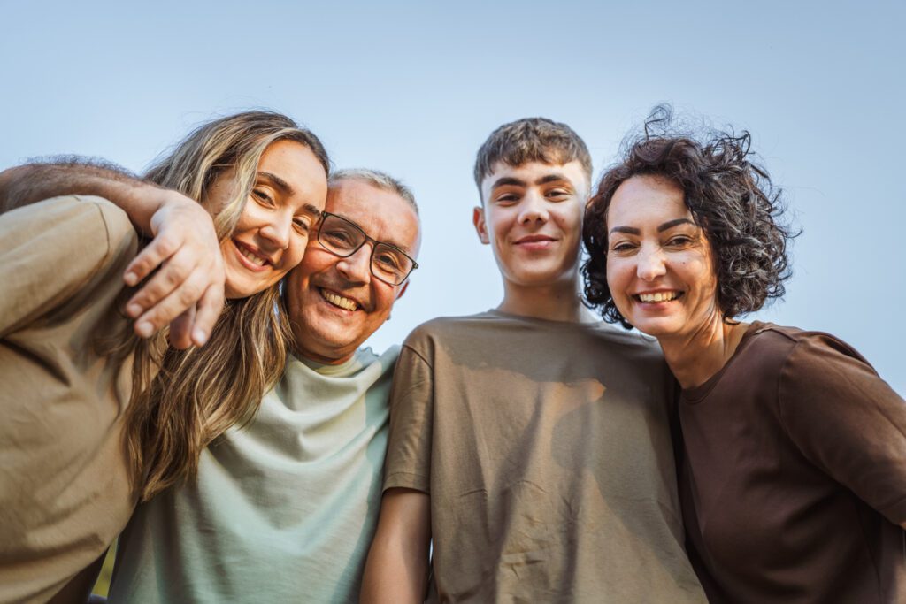 Portrait of caucasian hugged family spend time together in nature
