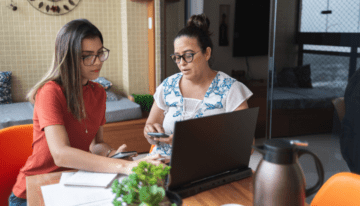 Daughter and mother going over college finances.