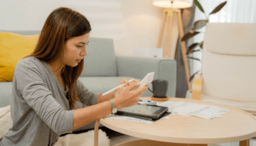 Female college student looking over finances.