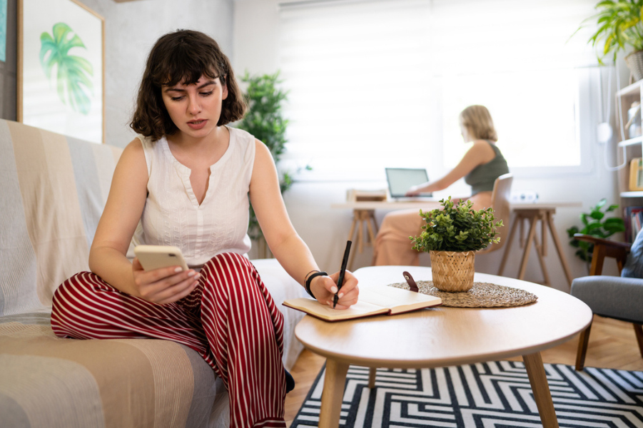 Young college female going over new income driven repayment plan for student loans.