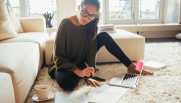 Young female college student going over finances.