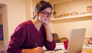 Female student looking at home much she can take out in student loans.