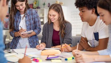 Group of college students studying together