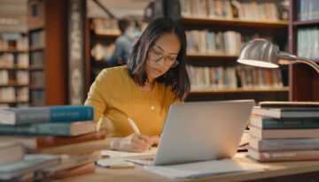 young woman studying on her laptop