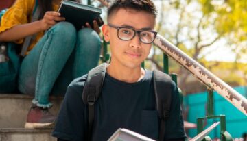 Young asian american male college student on campus.