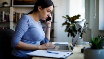 Young woman looking at the pro and cons of student loan consolidation.