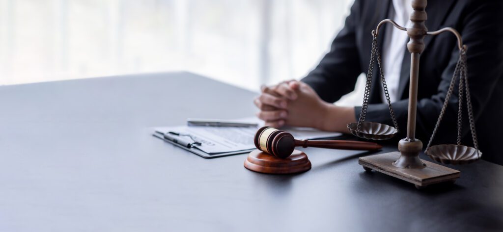woman looking over economic impacts of student loan forgiveness following the court ruling.
